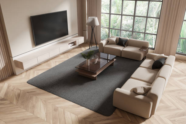 istock Modern living room with beige sofas and large TV on light wood floor. 3D Rendering 2184117963