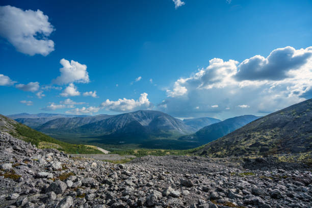 Scenic Mountain Landscape with Blue Sky and Rolling Hills