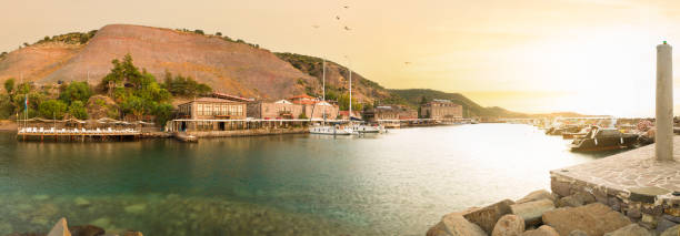 Panoramic sunrise in the ancient harbour of Behramkale. The beautiful touristic coast in the North Aegean. Canakkale province. Turkey.