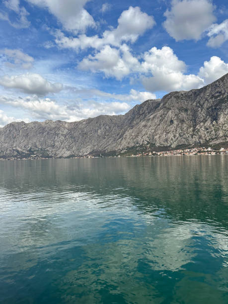Tranquil mountain landscape reflecting on a serene lake under a picturesque sky. the image captures the essence of natural beauty and peacefulness in wilderness.