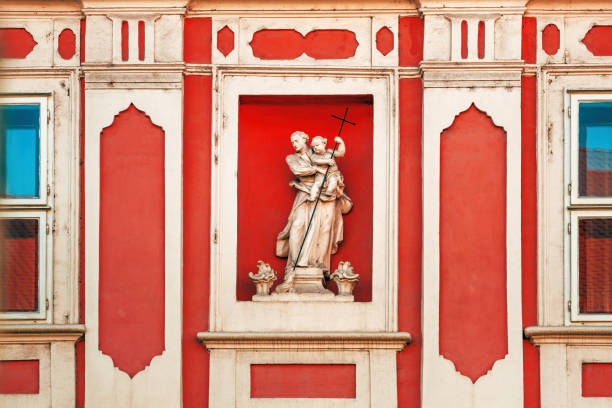 Concrete cast statue on vintage facade in Petrovaradin, Serbia. Horizontal image.