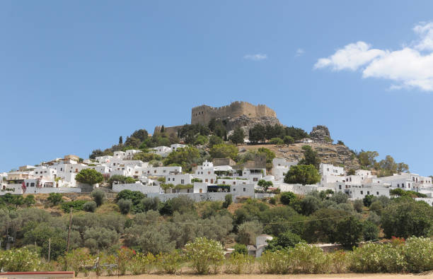 Dodecanese, Greece - May 19, 2010: View of the village and Acropolis of Lindos on the island of Rhodes