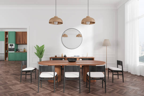 istock Home kitchen interior with dining table and drawer, cooking cabinet and window 2184119286
