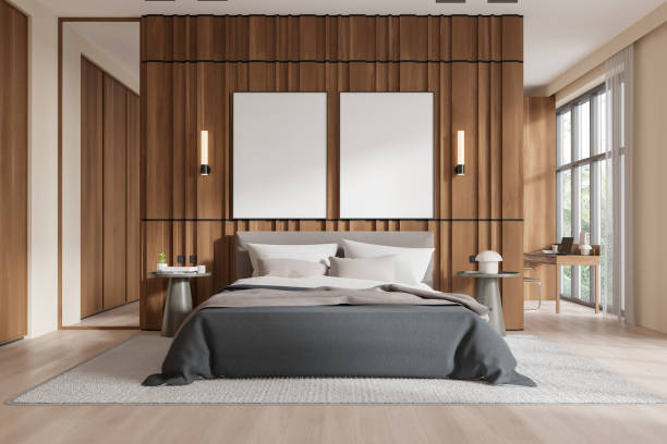 istock Modern bedroom with blank posters on wooden wall above bed. 3D Rendering 2184119458