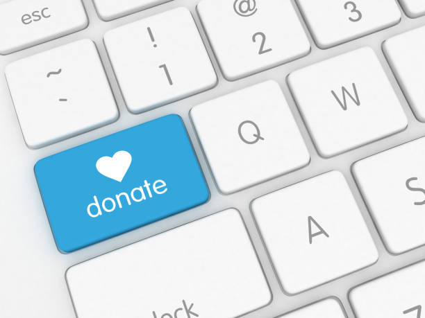 istock Donate button charity giving internet online payment keyboard 2184122138