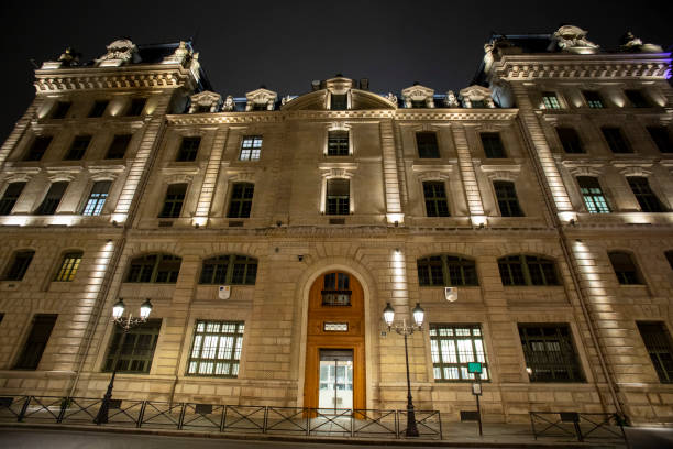 Illuminated State Police building on Rue de la Cité in Paris at night