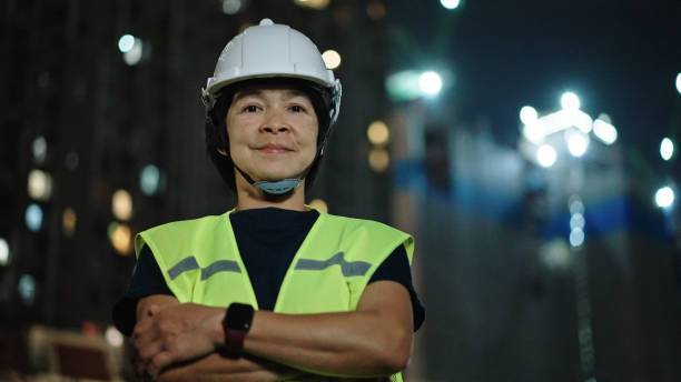 istock Portrait of engineer woman on construction site at night. 2184122766