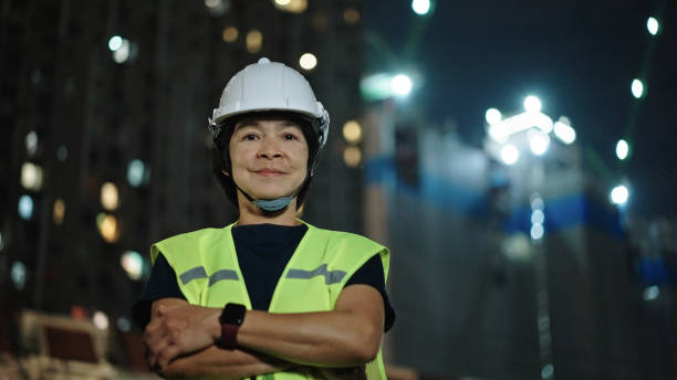 istock Portrait of engineer woman on construction site at night. 2184122771