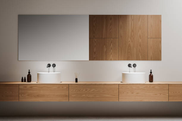 istock Wooden hotel bathroom interior with double sink and accessories on vanity 2184124331