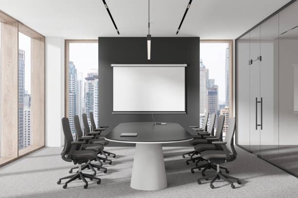 istock Stylish office room interior with board and projection screen, panoramic window 2184124630