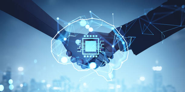 istock Man and robot handshake, AI brain hologram and cityscape 2184124729