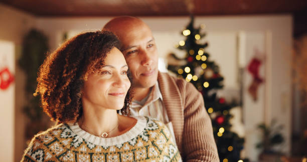 istock Christmas, mature couple or thinking in home with love, trust or commitment in relationship. Happy man, woman or hug in living room for festive season, celebrating tradition or bonding with affection 2184125004