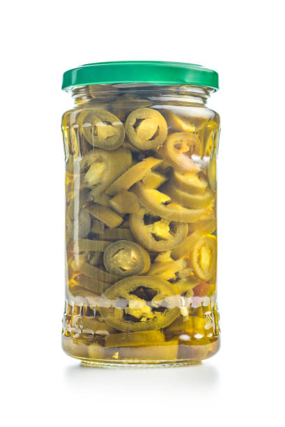 Fermented Foods - Preparing Fermented Mixed Chili Peppers and Filled in a Jar