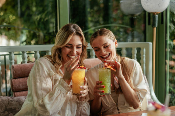 istock Friends enjoying colorful cocktails 2184125974