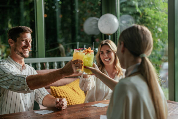 istock Three friends toasting with cocktails 2184125976