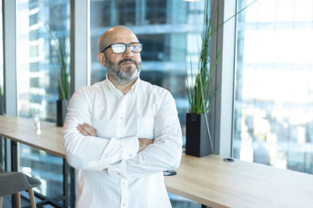 istock Confident Businessman Standing in Modern Office Environment 2184131693
