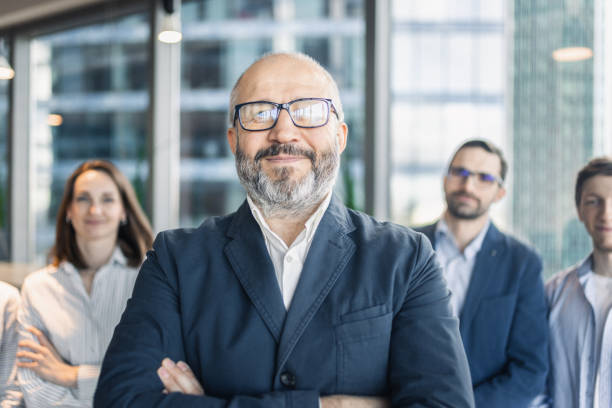 istock Confident Business Team Standing Together in Modern Office 2184132074
