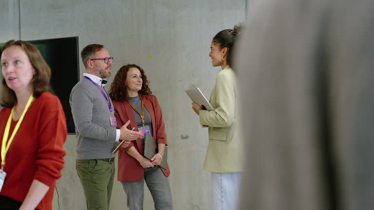 Business colleagues greeting each other with handshake at event