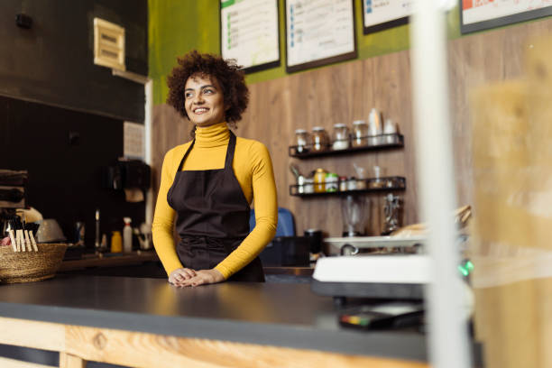 istock Woman working in small coffee shop 2184134152
