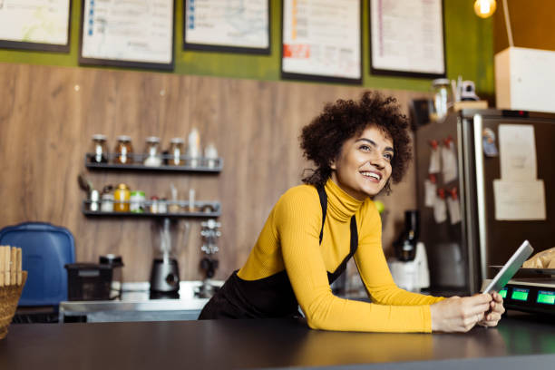 istock Woman working in small coffee shop 2184134208