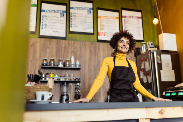 istock Woman working in small coffee shop 2184134231
