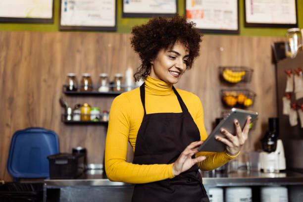 istock Woman working in small coffee shop 2184134250