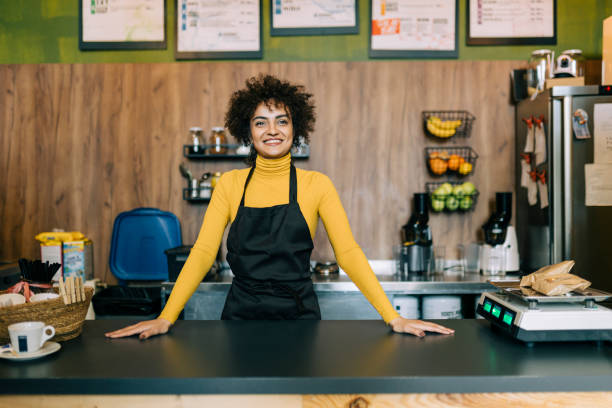 istock Woman working in small coffee shop 2184134264