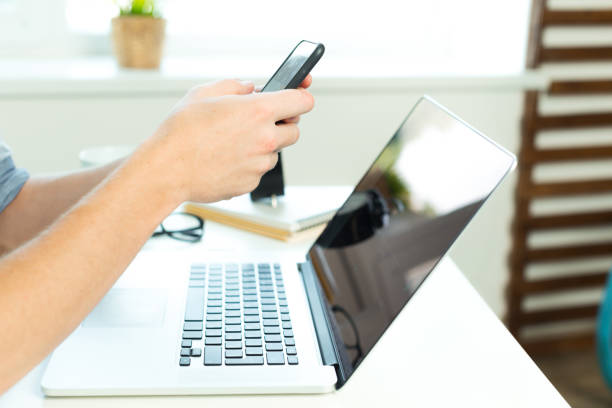 istock young student works on his laptop at home 2184135394