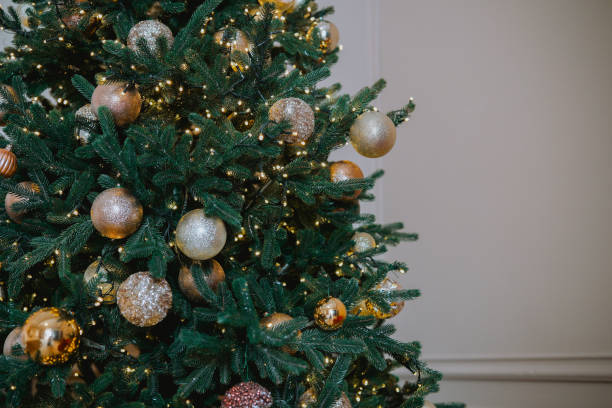 istock Decorated Christmas tree adorned with golden and silver ornaments indoors 2184135725