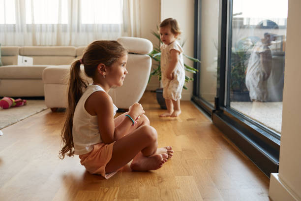 istock Beautiful sisters playing indoors 2184135919