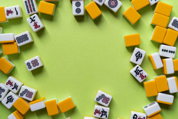 istock Mahjong tiles lined up on a green background 2184139573