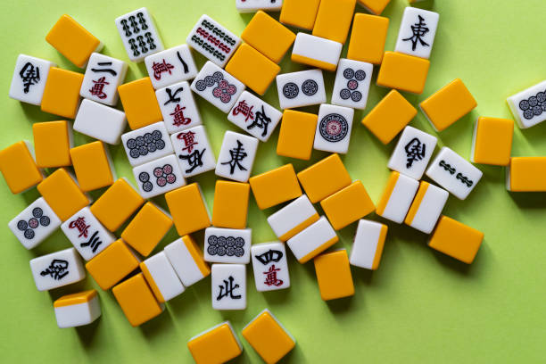 istock Mahjong tiles lined up on a green background 2184139598