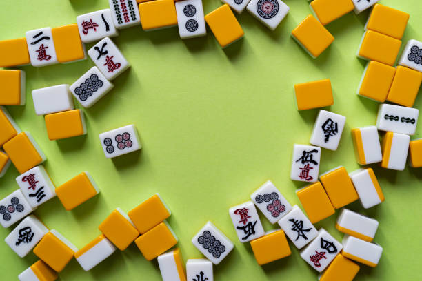 istock Mahjong tiles lined up on a green background 2184139627