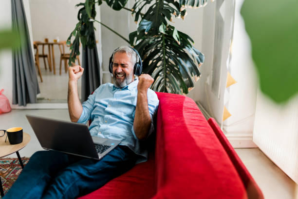 istock Senior man having video call and working at home 2184140508