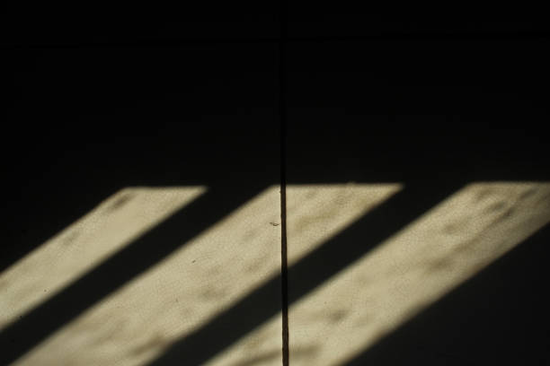 istock shadows on the floor. the sunlight coming in through the window creates shadows on the floor 2184142542