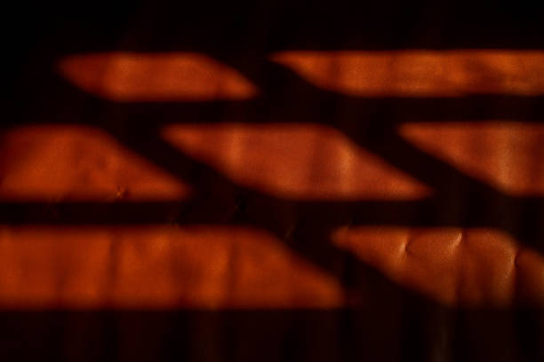 istock shadows on brown leather. the sunlight coming in through the window creates shadows on brown leather. 2184142967