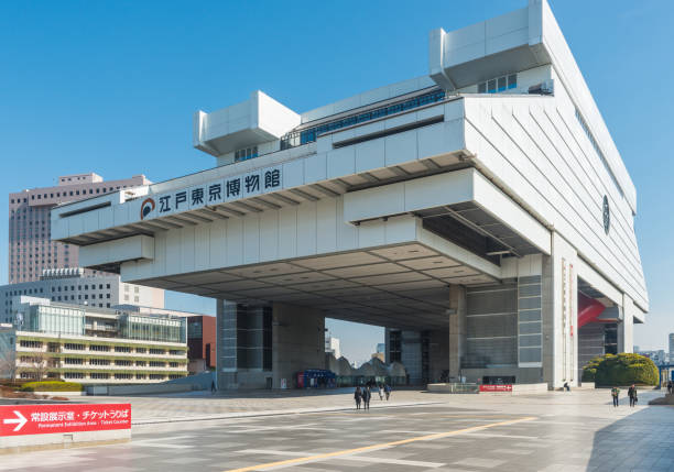 The iconic edifice of the Edo Tokyo Museum towering over visitors on the patio below in the Ryogoku district of central Tokyo, Japan.