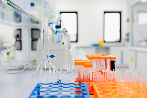 istock Close up of test tubes with different colored liquids on the table. 2184144506