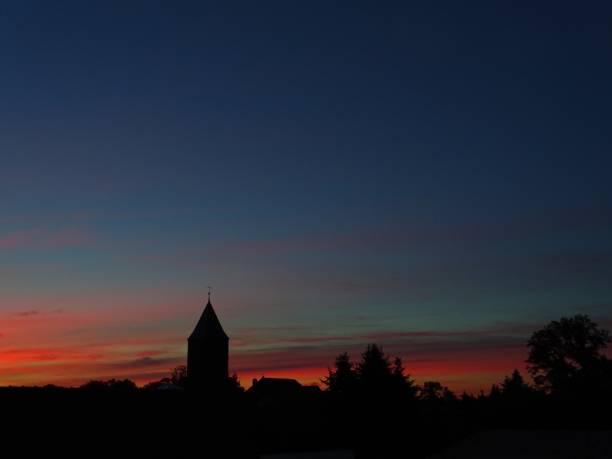 istock Village silhouette with sunrise 2184145530