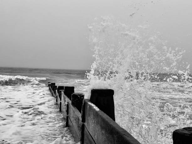 Seawater splashing over groyne