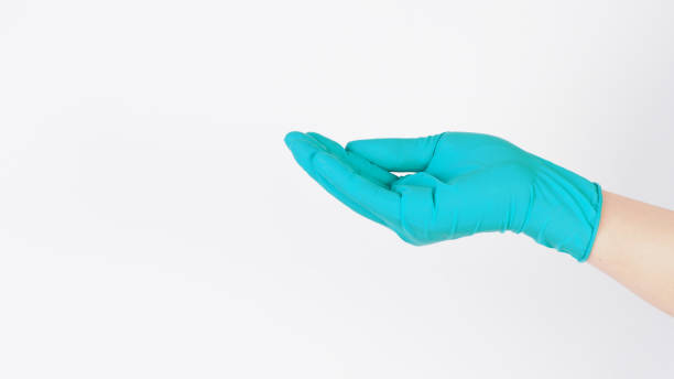 istock Empty ands wear aqua mint green latex gloves on white background. 2184147638
