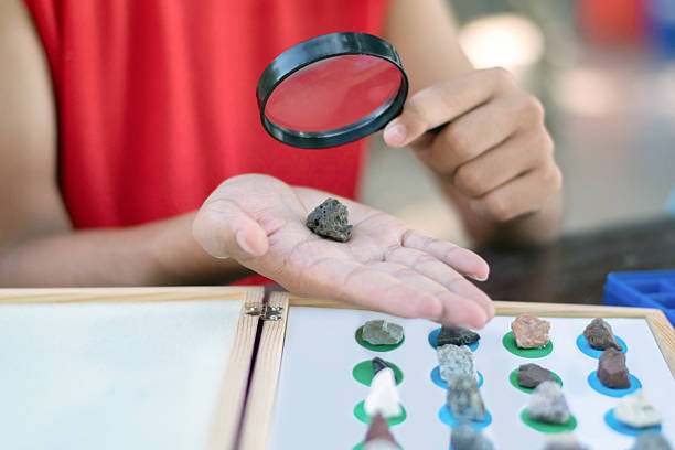 istock Asian schoolboy with various kind of rocks study. 2184152394