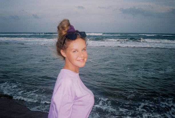 istock portrait woman on the ocean shore 2184152583