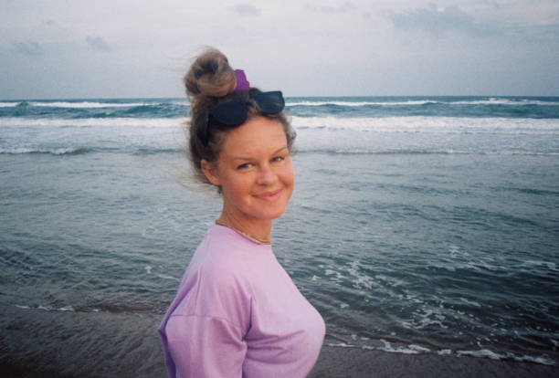 Portrait of young woman chilling on the ocean shore