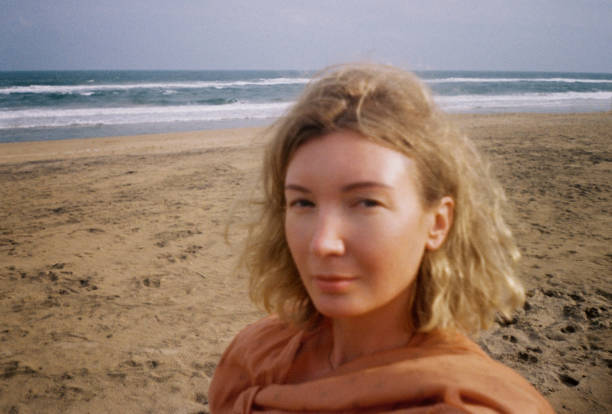 istock portrait woman on the ocean shore 2184152585