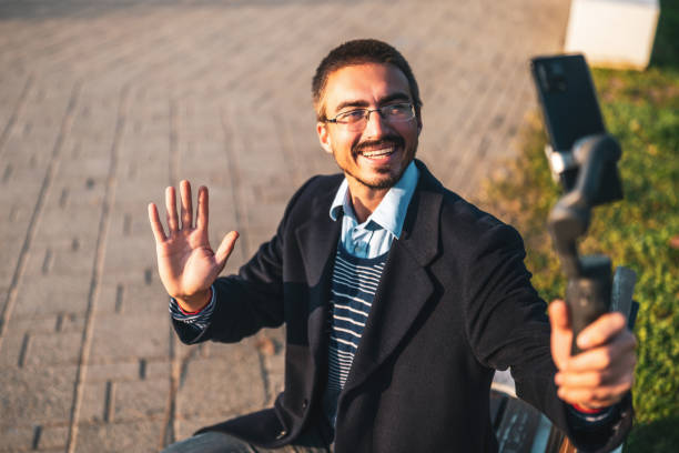 istock Smiling businessman vlogging outdoor 2184153701
