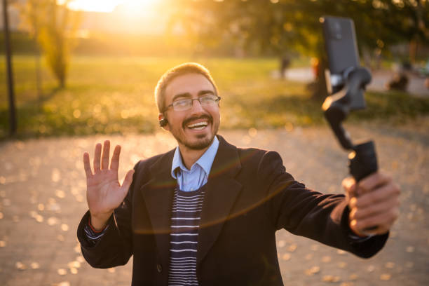 istock Smiling businessman vlogging outdoor 2184154010