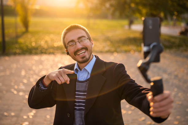 istock Happy businessman vlogging outdoor 2184154024