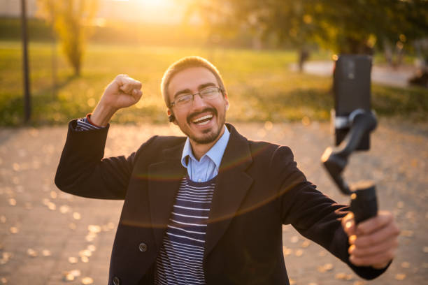 istock Confident businessman vlogging outdoor 2184154055