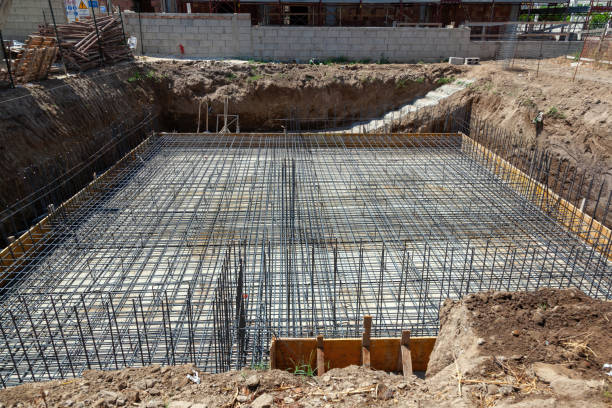 istock Foundation reinforcement steel bars creating a grid structure for concrete pouring 2184154486